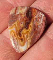 stone guitar pick made out of crazy lace agate